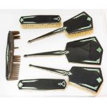 An Art Deco black enamelled, jade and marcasite set brush and mirror set,
