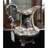 An early Victorian silver cream jug, baluster shaped with wavy rim, S-scroll handle,