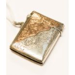 An unusual Edwardian parcel-gilt (9ct gold and silver) vesta case,