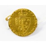 A George III gold Guinea, 1797, the back applied with a C clasp, forming a brooch,