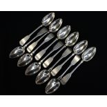 A set of eleven George IV Scottish sterling silver fiddle pattern dessert spoons,