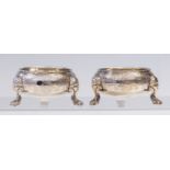 A pair of George II Baroque silver circular salts,