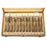 A 19th Century Austrian silver twelve piece fish knife and fork in fitted oak canteen,