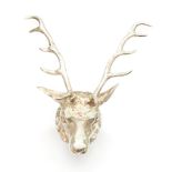 A late Victorian silver stirrup cup realistically cast as a stag's head, gilt interior,