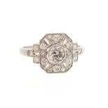 An Art Deco style diamond platinum ring, the central round brilliant cut diamond collet set,