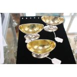 A set of three George III Scottish silver salts, boat-shaped with beaded rim on oval feet,