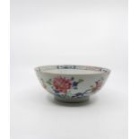 Three Chinese famille rose bowls; the first made for the export market, underglaze blue outlines,