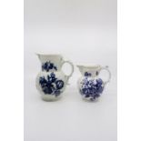 Two Worcester jugs, three flowers pattern, both with mask spout, the larger one Height 18 cms, spout