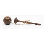 A Victorian fruitwood "catch me if you can" ball and handle game