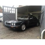 A 1998 right hand drive Jaguar XJ8 saloon, British racing green metallic, 3200cc V8 engine, 30,