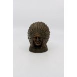 A Guy Motors Ltd "Feathers in our cap" Indian head desk ornament.