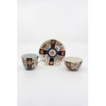 A Worcester trio of tea bowl, coffee cup and saucer, painted in the ‘Kakiemon’ palette of the ‘