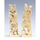 Two Japanese ivory okimonos, Meiji period, 1868-1912, one carved as a man holding a mask, the