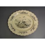 A large oval creamware platter with a fluted rim, black printed with exotic birds, circa 1800, 35.