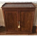 A 19th Century mahogany two door side cabinet, enclosing adjustable shelves, 90cm high, 84cm wide,