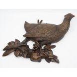 A carved hardwood figure of a pheasant  a/f tail missing.
