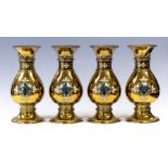 A set of four late 19th Century brass ecclesiastical baluster vases of Gothic design, attributed