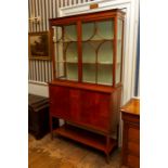 An Edwardian satinwood standing vitrine in the Sheraton Revival style, circa 1905, boxwood and ebony