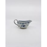 18th Century Chinese export sauce boat with brass handle, blue and white with floral sprigs, swags