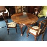 An early 20th Century mahogany extending dining table, complete with three extra leaves, 300cm long,