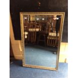 A contemporary gilt framed mirror, 93cm high, 62cm wide