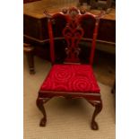 A Georgian style mahogany side chair, in the manner of Thomas Chippendale, the back with a carved