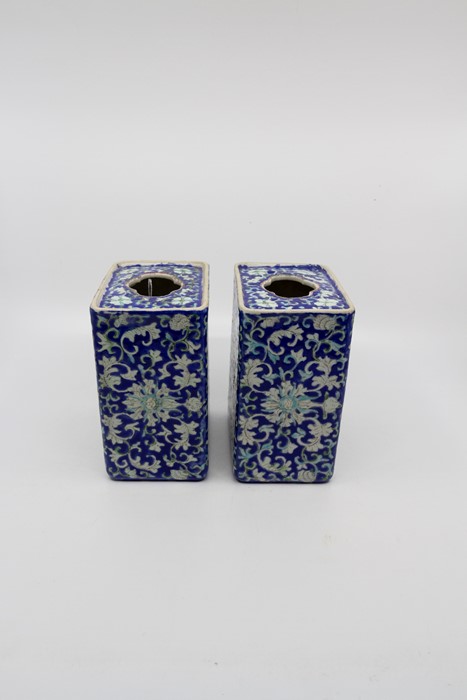 A pair of Chinese Qing dynasty porcelain pillow rests, decorated with lotus flower, probably Guangxu