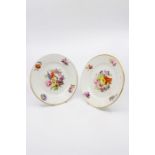 A pair of mid to late 19th Century hand painted floral Derby plates. Red mark. Size  22.5cm.