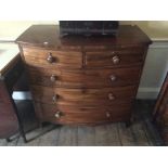 An early 19th Century mahogany bow-fronted, fitted with two short over three long drawers, raised on