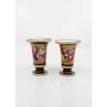 A matched pair of Coalport style footed vases, having hand painted panel on cobalt blue and gilded