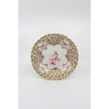 A Samson of Paris dessert plate, decorated with a border of gilt circles with a painted rose, the