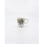A Worcester Polychrome Coffee Cup. Decorated with floral sprays. Circa 1775. Size 5.7cm. diameter,