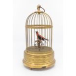 A 20th Century German gilt metal bird cage automaton, the red and black 'bird' on a perch in a