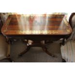 A Regency rosewood tea table, in laid with stylised foliage and stringing in brass, the fold-over