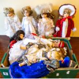 A box containing a large quantity of modern bisque head dolls including Leonardo, Alberon etc.