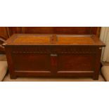 A mid 17th Century oak transitional chest, the boarded construction to sides and frame and panel