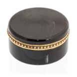 Cartier, an early 20th Century Cartier circular tortoiseshell lidded trinket box, gold mount with