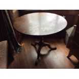 A George III mahogany tripod table, raised on a turned column and standing on three cabriole legs