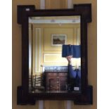 An 18th Century walnut veneered wall mirror with bevelled panel glass 42cm x 63cm