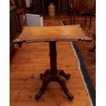 A 19th Century Gothic Revival oak pedestal table, the concave top inscribed, and decorated with a