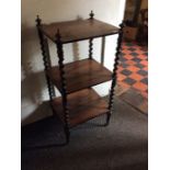 A Victorian rosewood three-tier dumb waiter, barley twist supports, 86cm high, 40cm wide, 35cm deep