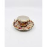 A Pinxton teacup and saucer, circa 1800, Three flower panel Imari palette with diaper panels and