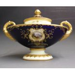 A Coalport oval shaped vase and cover, cobalt blue and yellow ground, painted with a landscape in