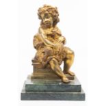 A gilt bronze figure of St John the Baptist as a child, on stepped green marble base, probably