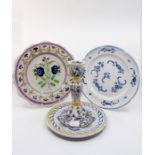 A collection of Faience plates and dishes, blue and white and polychrome decoration along with a