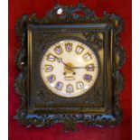 A 19th Century French ornately framed wall clock, enamel shields painted blue Roman numerals,