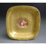 A Royal Worcester acid etched gilded square dessert dish with a central reserve painted with fruit