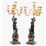 A pair of candelabra on marble base with classical figural bronze stems with gilt floral adornments,