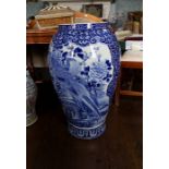 A large Japanese blue and white floor standing vase, late 19th Century, of bombe form decorated with