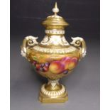 A Royal Worcester twin handled vase and cover, painted with fruit and gilding, shape 1572, signed P.